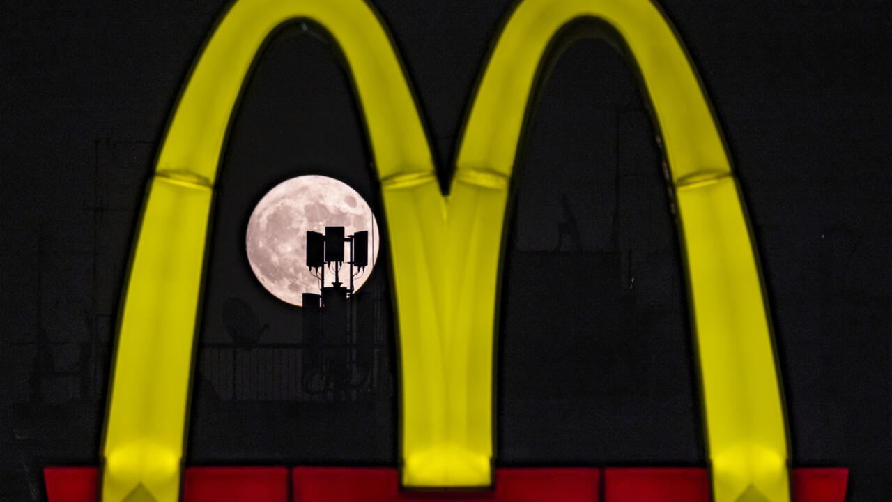 McDonald's profits dented by food poisoning outbreak